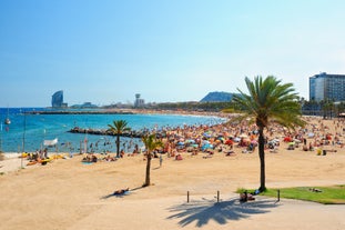 Photo of Sand beach and historical Old Town in mediterranean resort Sitges near Barcelona, Costa Dorada, Catalonia, Spain.