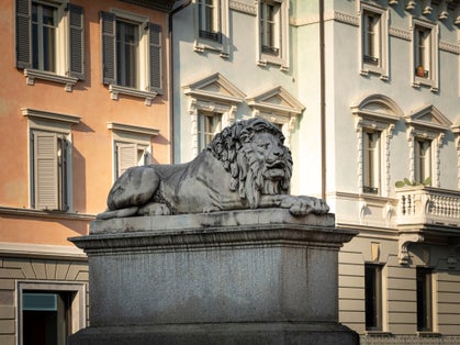 Statue of one of the two Lions placed on the pylons of the "Ponte dei Leoni", in the city center of Monza (Italy)