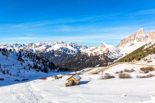 photo of the romantic, Snow covered Skiing Resort of Cortina d Ampezzo in the Italian Dolomites seen from Tofana with Col Druscie in the foreground.