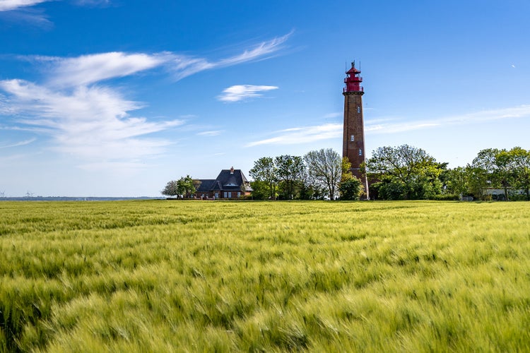 Photo of The beautiful Lighthouse Of Flügge On The Isle Of Fehmarn at the Baltic Sea in Germany. Summer in Germany.