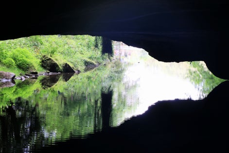 Photo of the Caves of Han with river lesse in Han sur lesse, Belgium.
