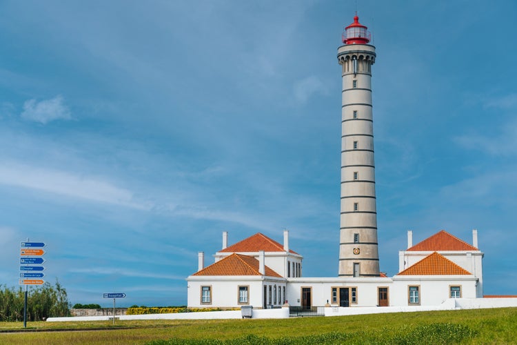 View of lighthouse, typical Portuguese architecture, with nice details and very particular framing, blue sky as background, located in Leça da Palmeira, Porto, Portugal. Matosinhos.