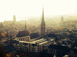 Panoramic view of historic Zurich city center with famous Fraumunster, Grossmunster and St. Peter and river Limmat at Lake Zurich on a sunny day with clouds in summer, Canton of Zurich, Switzerland