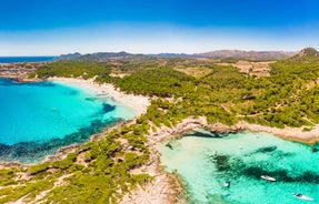 Photo of aerial view of Cala Agulla and beautiful coast at Cala Ratjada, Mallorca, Spain.