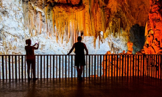 photo of two people in the wonder Gilindire Cave in Mersin, Turkey.