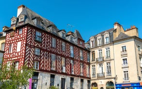 Photo of traditional half-timbered houses in the old town of Rennes, Brittany, France.