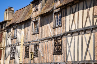 Photo of traditional half-timbered houses in the old town of Rennes, Brittany, France.