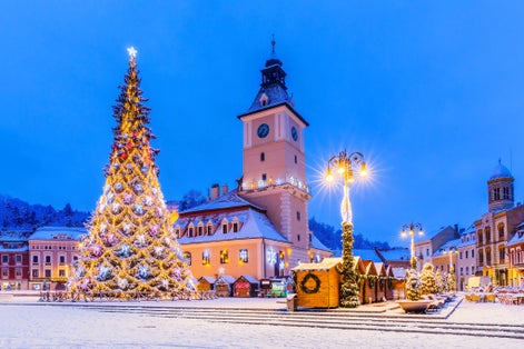 Photo of Brasov, Romania. Medieval Council House in the Main Square at winter of the Old Town.