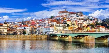 Porto, Portugal old town ribeira aerial promenade view with colorful houses, Douro river and boats.