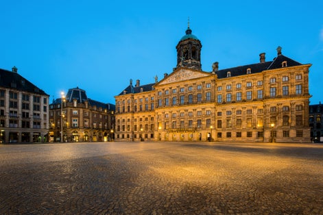 Photo of The Royal Palace at night in Dam square at Amsterdam, Netherlands.