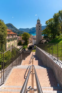photo of Lugano with the Cathedral of San Lorenzo and Monte Bré in Switzerland.