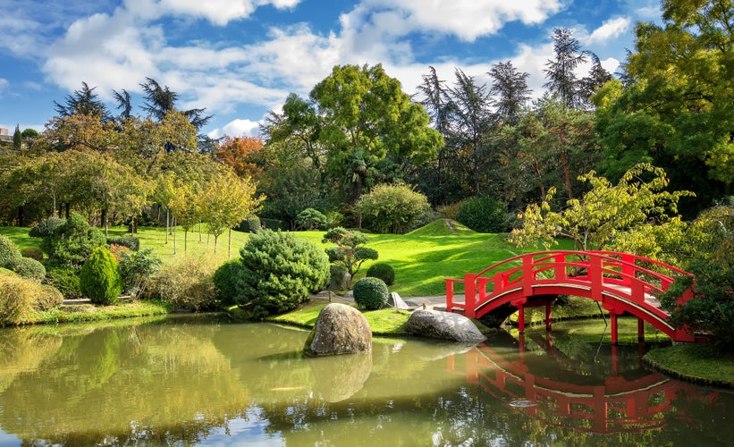 Photo of Japanese Garden with small pond on a sunny day. Compans Caffarelli district. Toulouse.