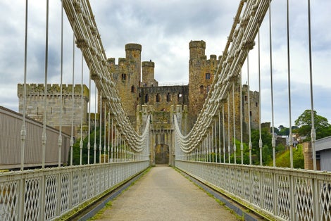 Conwy Castle and Conwy Suspension Bridge – built in 1826. Conwy Castle, North Wales. It belongs among Castles and Town Walls of King Edward in Gwynedd - UNESCO World Heritage site. UK