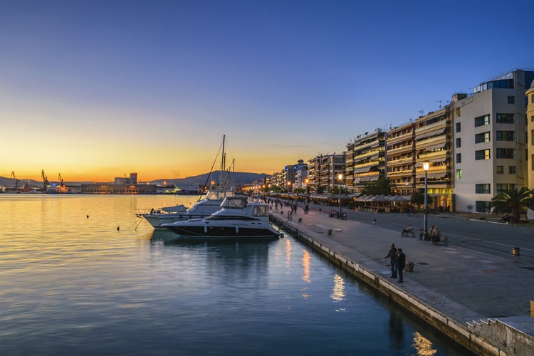 Photo of sunset at the port of Volos city, the capital of the Magnesia regional unit, Greece.