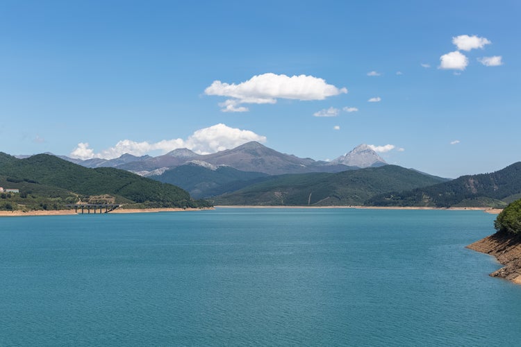 Photo of view at the Riaño Reservoir, located on Picos de Europa or Peaks of Europe, a mountain range forming part of the Cantabrian Mountains in northern Spain.