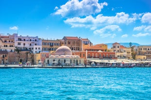 Photo of aerial view of Chania with the amazing lighthouse, mosque, venetian shipyards, Crete, Greece.