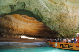 Photo of wide sandy beach in white city of Albufeira, Algarve, Portugal.