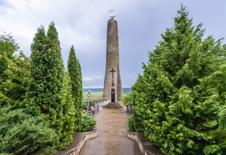 Photo of Thanksgiving or Gratitude Candle, tall candle-shaped monument in Soroca city, Moldova.