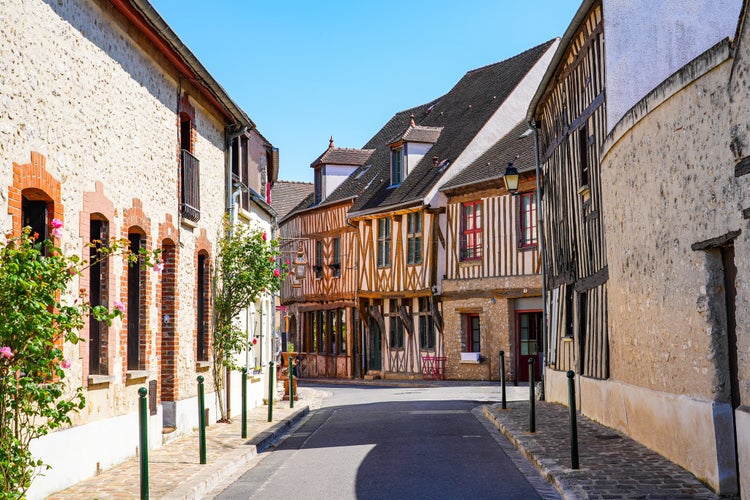 photo of view of Half-timbered houses in the main shopping street of the popular medieval town of Provins in Seine et Marne, Paris region, France