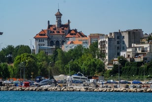 Antique building view in Old Town Bucharest city - capital of Romania and Dambrovita river. Bucharest, Romania, Europe.