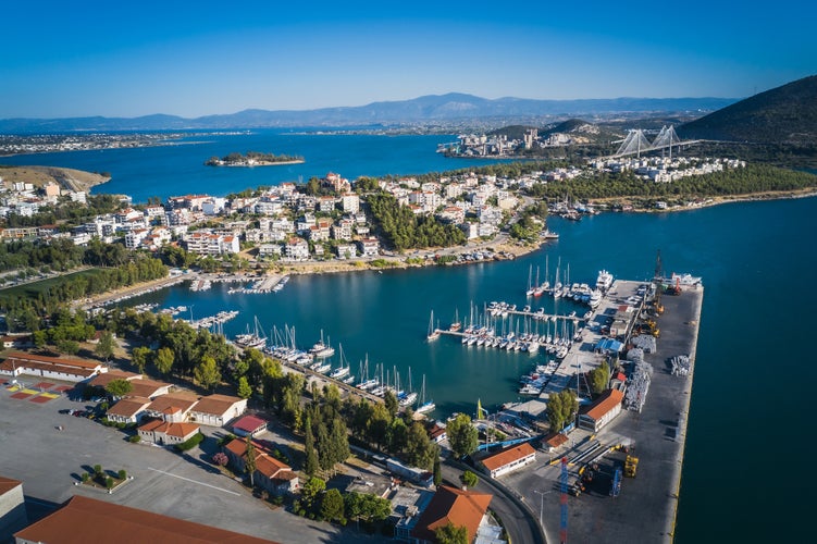 Photo of aerial drone bird's eye view photo from famous city of Chalkida with clear water seascape.