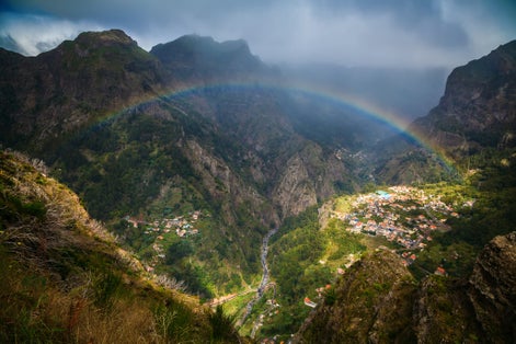 Photo of panoramic view of the rainbow above Nun's Valley, Madeira, Portugal.