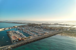 Photo of Beach seashore with wooden path to sea water in San Pedro del Pinatar