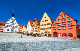 Photo of aerial view of the historic city center of Freiburg im Breisgau from famous old Freiburger Minster in beautiful evening light at sunset, Germany.