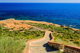 photo of aerial panoramic drone point of view Cabo Roig coastline with blue Mediterranean Seascape view, residential buildings near sandy beach at sunny summer day. Province of Alicante, Costa Blanca. Spain.