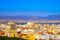 photo of an aerial view of Cagliari, in Sardinia, Italy, with the Montelargius lake and Quartu Sant Elena in the background.