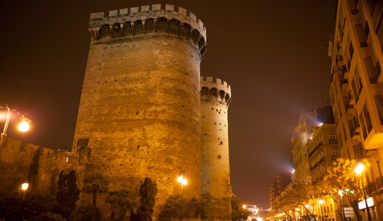 Photo of Torres de Quart Quarte in Valencia towers old city fort entrance at night .