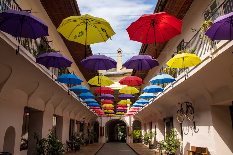 Colourful umbrellas in an alleyway on a sunny day in central Kosice in Slovakia.