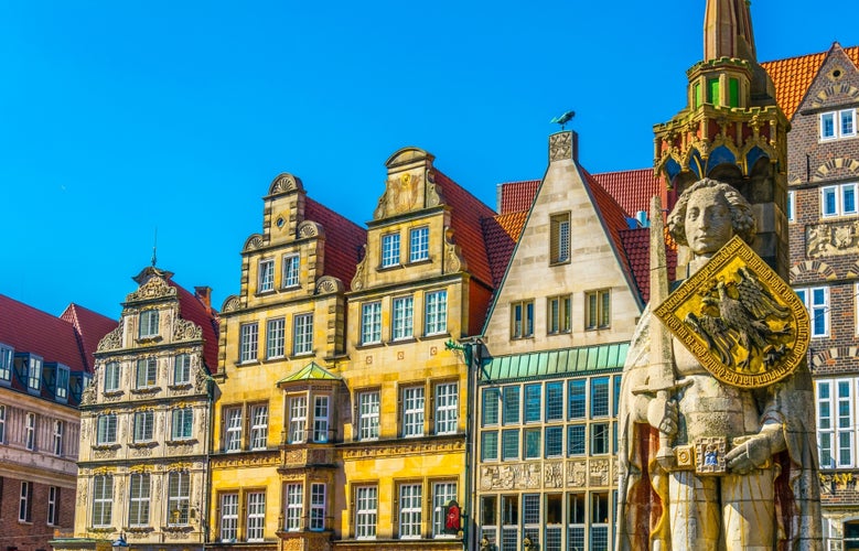 Photo of colorful facades with bremer roland statue in Bremen, Germany.