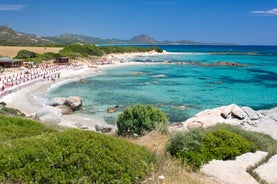 Photo of aerial view of a beautiful bay with azure sea from top of a hill, Villasimius, Sardinia island, Italy.