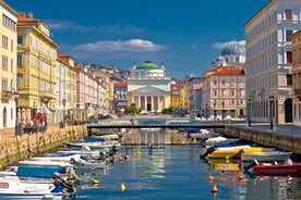 Famous buildings, gondolas and monuments by the Rialto Bridge of Venice on the Grand Canal, Italy.