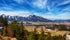 Photo of panoramic aerial view of Reutte with Alps and clouds, Austria.