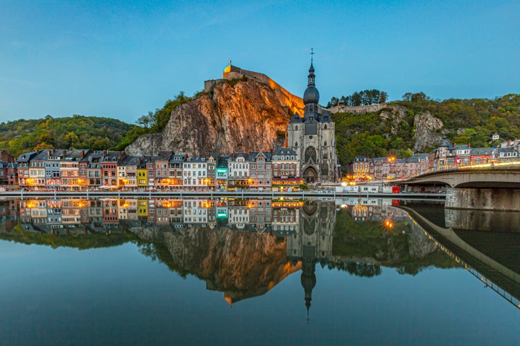 Classic view of the historic town of Dinant with scenic River Meuse in beautiful golden evening light at sunset, province of Namur, Wallonia, Belgium