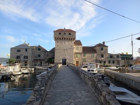 photo of a beautiful panoramic view of Kastel Luksic harbor and landmarks summer view, Split region of Dalmatia, Croatia.