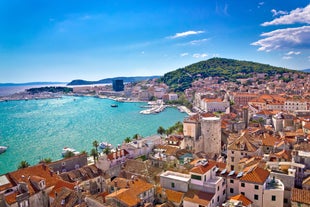 photo of a beautiful panoramic view of Kastel Luksic harbor and landmarks summer view, Split region of Dalmatia, Croatia.