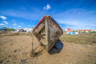 Photo of aerial view of pier fishing boats in the village Cabanas de Tavira, Portugal.