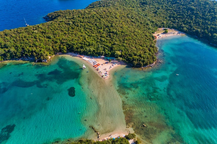 photo of aerial drone bird's eye view of Bella Vraka Beach with turquoise sea in complex islands in Sivota area near to Igoumenitsa , Ionian sea, Epirus, Greece.