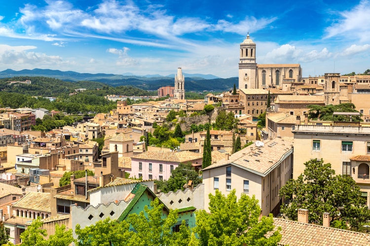 Photo of panoramic aerial view of Girona and cathedral in a beautiful summer day, Catalonia, Spain.