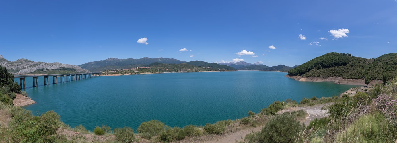 Photo of panoramic view at the Riaño Reservoir, located on Picos de Europa or Peaks of Europe, a mountain range forming part of the Cantabrian Mountains in northern Spain.