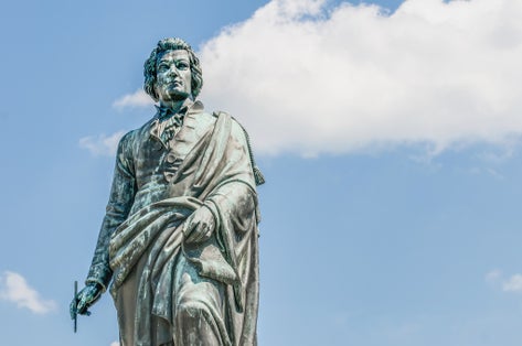 photo of view of Mozart statue on Mozart Square (Mozartplatz) located at Salzburg, Austria.