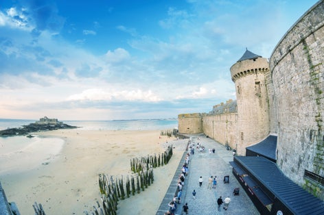 Saint Malo beach and city medieval architecture during Low Tide. 