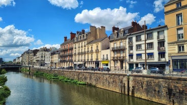 Photo of traditional half-timbered houses in the old town of Rennes, Brittany, France.