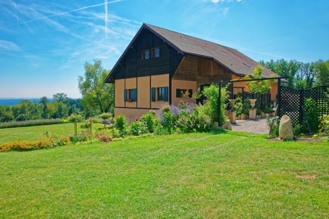 Photo of Swiss House in a village in Yverdon les Bains at Jura Nord Vaudois district of Canton Vaud, Switzerland.