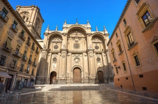 Photo of aerial view of Jaen with cathedral and Sierra Magina mountains on background, Andalusia, Spain.