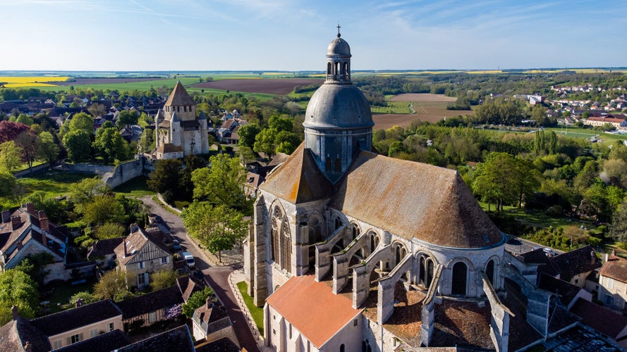 photo of view of Aerial view of the Saint Quiriace Collegiate Church in Provins, a medieval city in Seine et Marne, France - Slate dome on top of a hill in the French countryside