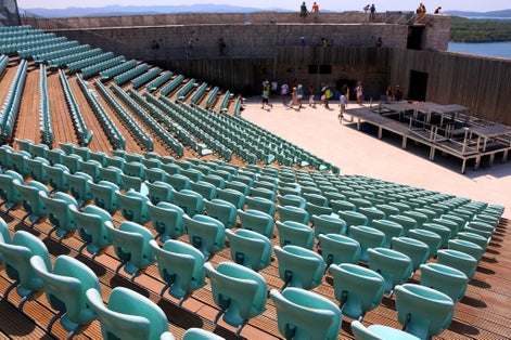Photo of tourists visiting St. Michael's Fortress, landmark in Sibenik, Croatia.
